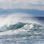 Beautiful ocean waves crashing below a mountain landscape imbues a sense of inner-connectedness and oneness.